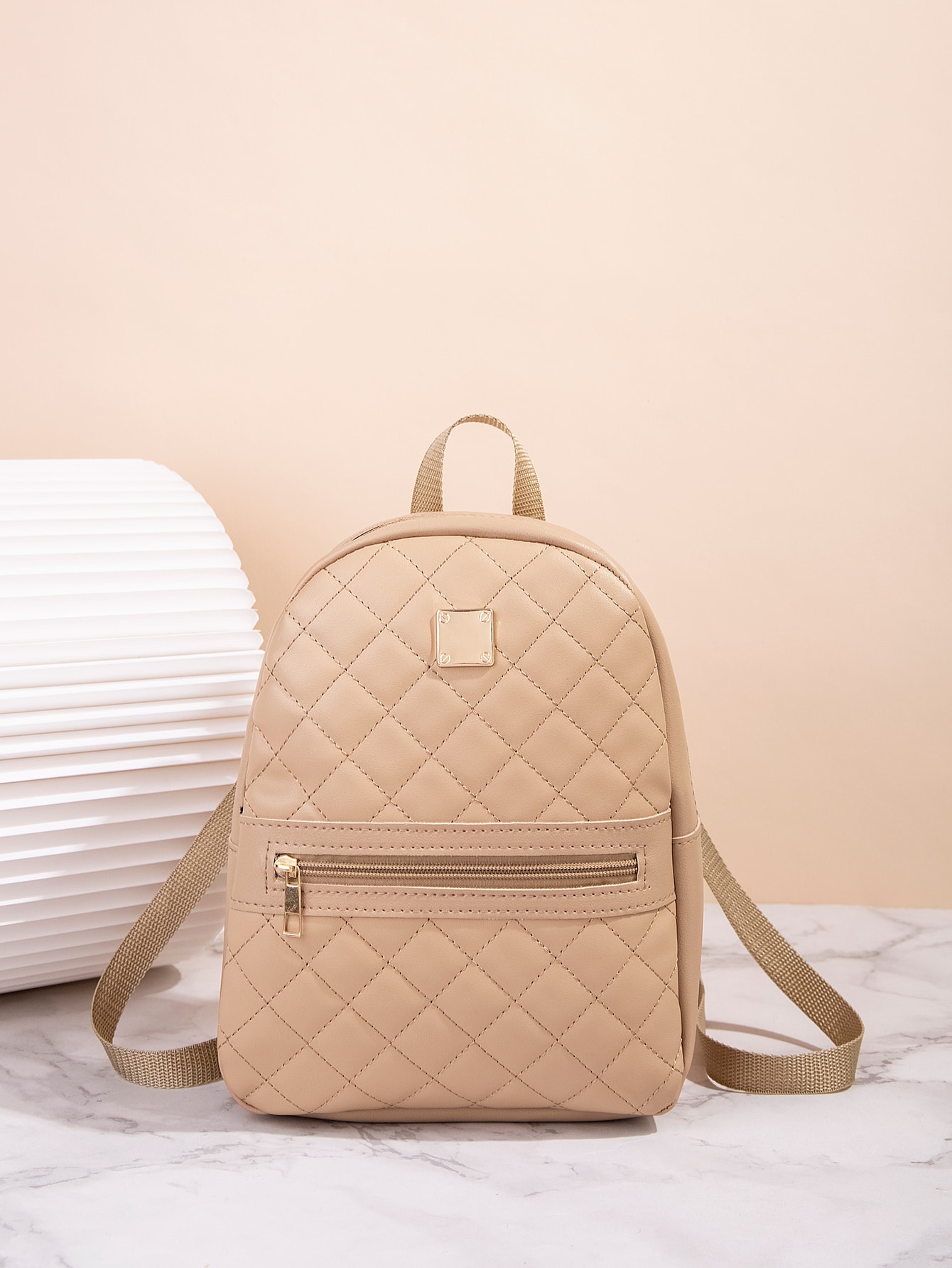 Quilted pattern front zipper back backpack