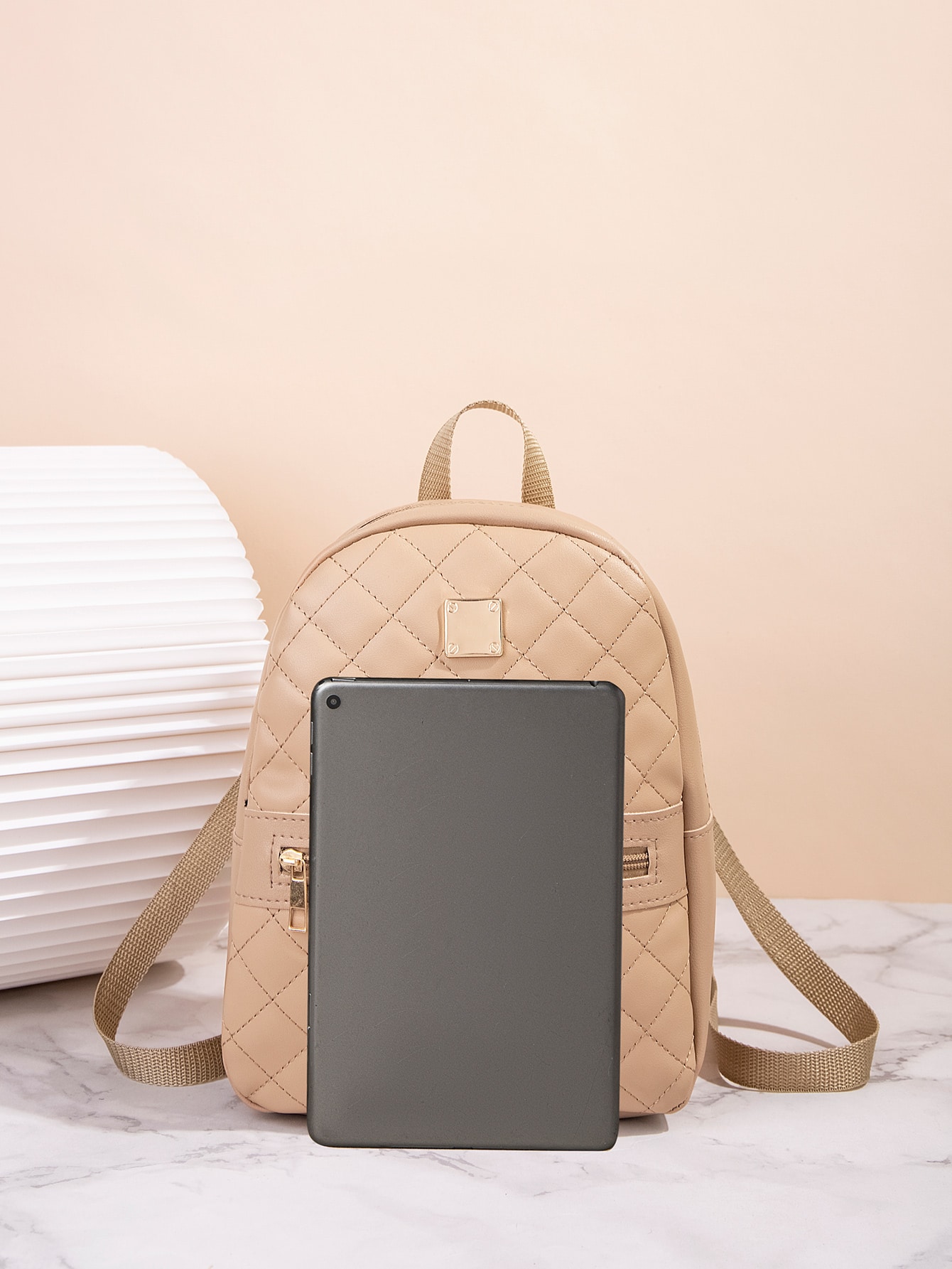 Quilted pattern front zipper back backpack