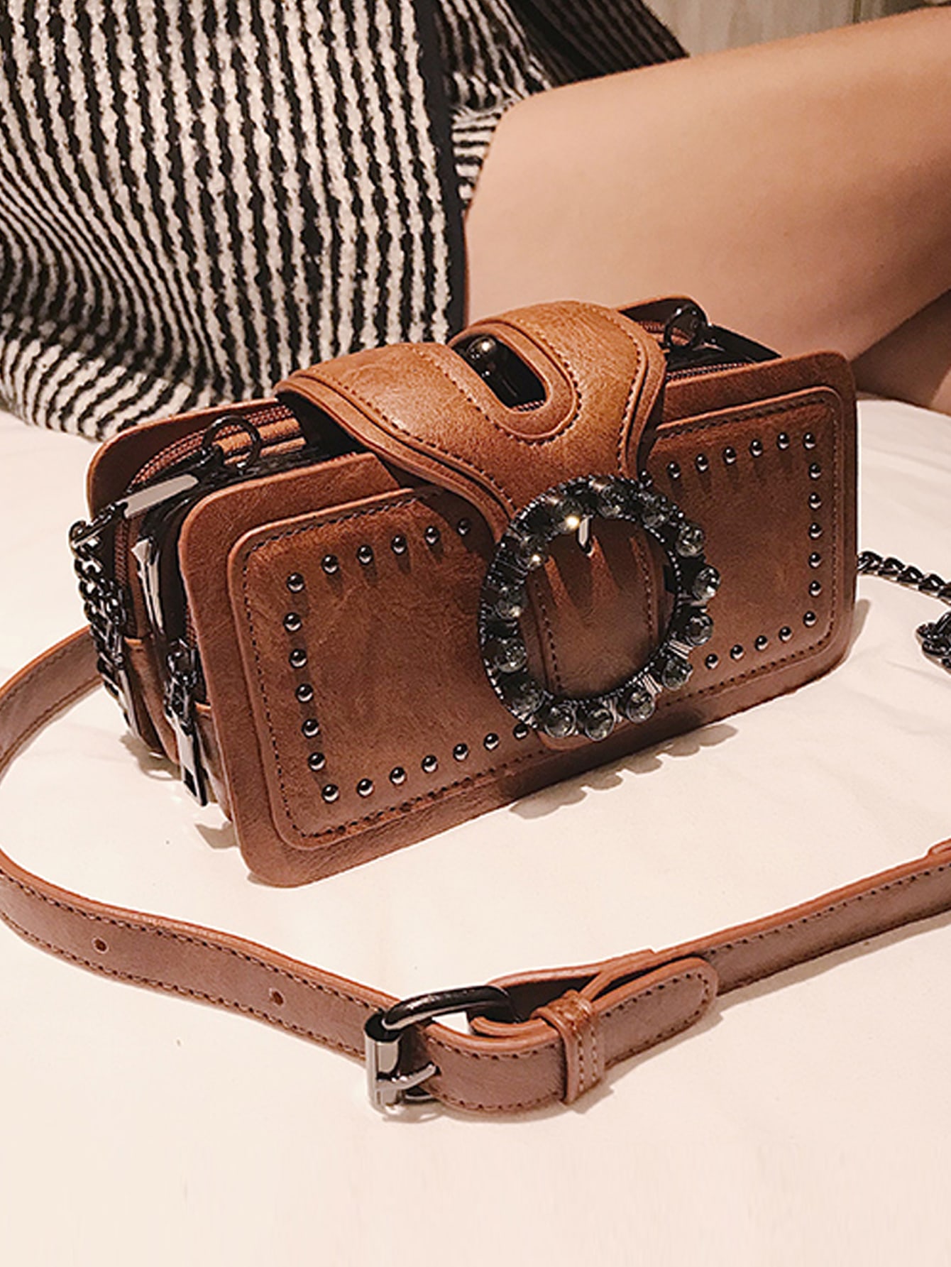 Square bag with studs and buckles