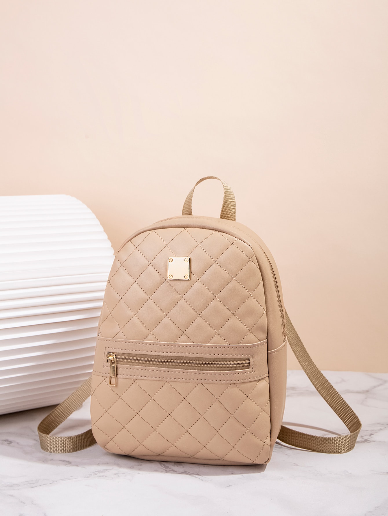 Quilted pattern front zipper back backpack